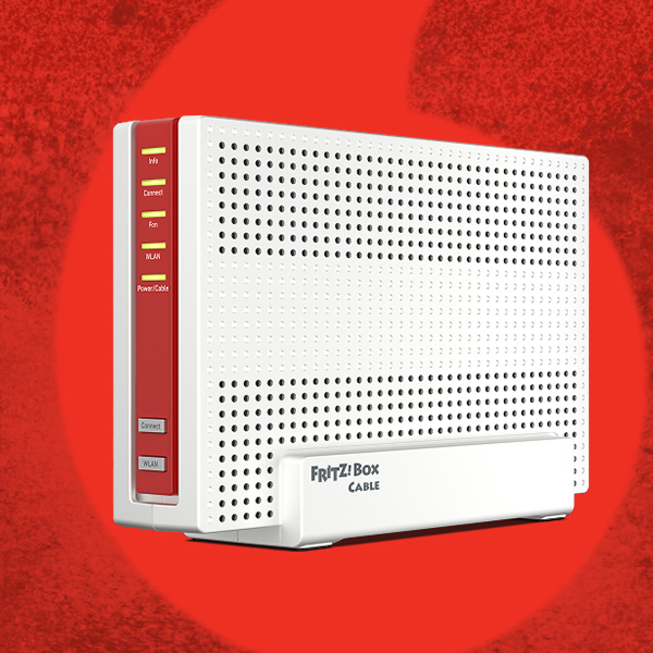 WLAN-Router (FRITZ!Box) vor rotem Hintergrund.